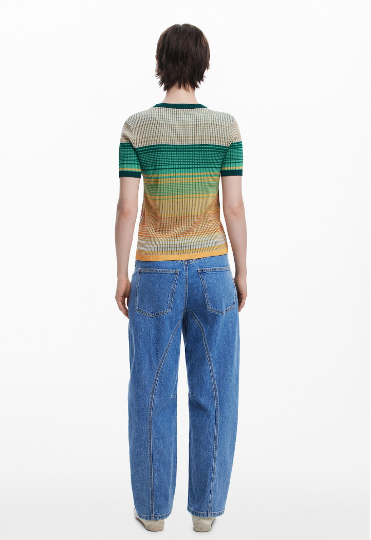 back view of woman wearing striped t-shirt